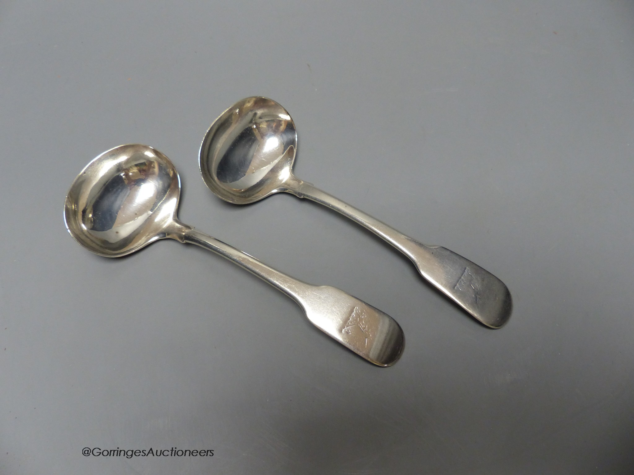 A pair of George IV silver fiddle pattern sauce ladles, by William Bateman, London, 1820, 17.5cm, 137 grams.